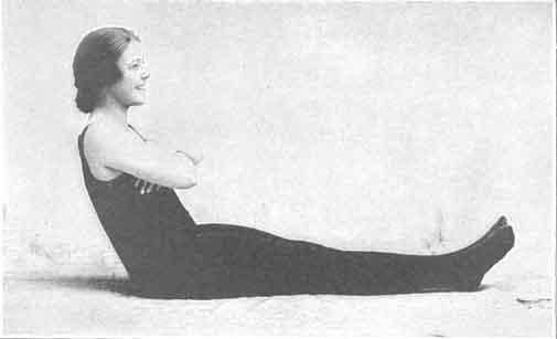 Lying on the back with arms folded, raising body to a sitting position